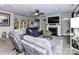 Comfortable living room with modern fireplace, display shelving, and gray accent furniture at 1805 Axholme Ct, Waxhaw, NC 28173