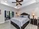 A spacious primary bedroom features a trey ceiling, ceiling fan and an attached sitting room at 1805 Axholme Ct, Waxhaw, NC 28173