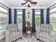 Bright and airy sitting room with comfortable armchairs and plenty of natural light at 1805 Axholme Ct, Waxhaw, NC 28173