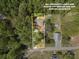 Aerial view of the property, showcasing its location within a lush, wooded area at 208 Spinners Dr, Cherryville, NC 28021