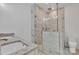 This primary bathroom features a marble tile shower with frameless glass and granite counters at 208 Spinners Dr, Cherryville, NC 28021