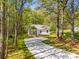 Charming home with a long driveway and lush greenery at 208 Spinners Dr, Cherryville, NC 28021