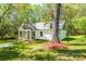 Beautiful home showcasing an inviting front porch and well-maintained landscaping at 208 Spinners Dr, Cherryville, NC 28021