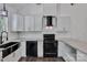 Stylish kitchen equipped with stainless steel appliances, modern cabinetry, and elegant countertops, ideal for cooking at 208 Spinners Dr, Cherryville, NC 28021