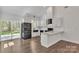 Modern kitchen with stainless steel appliances, sleek cabinetry, and plenty of natural light with backyard access at 208 Spinners Dr, Cherryville, NC 28021