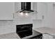 Elegant kitchen with black appliances, white cabinetry, and sleek countertops with pendant lighting, maximizing appeal at 208 Spinners Dr, Cherryville, NC 28021