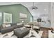 Bright living room featuring vaulted ceilings, modern decor, and an open-concept design to the kitchen at 208 Spinners Dr, Cherryville, NC 28021