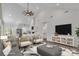 Open-concept living room with modern furnishings, sleek decor, and seamless flow into the dining and kitchen areas at 208 Spinners Dr, Cherryville, NC 28021