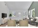 Well-lit living room boasting large windows, neutral decor, and an open layout ideal for Gathering gatherings at 208 Spinners Dr, Cherryville, NC 28021
