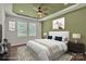 This bedroom boasts a ceiling fan, neutral carpet, and white walls, creating a serene and inviting atmosphere at 208 Spinners Dr, Cherryville, NC 28021
