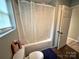 Bright bathroom featuring a shower-tub combo with curtain and a toilet at 2116 Dana Pl, Shelby, NC 28152