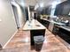 Kitchen with dark cabinets, granite countertops, and a center island at 2116 Dana Pl, Shelby, NC 28152