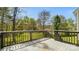 View from the back deck with backyard and wooded area at 2120 Turtle Point Rd, Charlotte, NC 28262