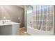 Bathroom with a vanity sink, tub, and shower with patterned shower curtain at 2120 Turtle Point Rd, Charlotte, NC 28262