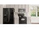 Well-equipped kitchen showcases sleek black appliances, light countertops, and ample cabinet space at 2120 Turtle Point Rd, Charlotte, NC 28262