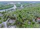 Stunning aerial view of a lake community surrounded by lush green trees and waterways, offering natural beauty at 2144 Newhart Rd, Charlotte, NC 28214