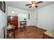 Bright bedroom with wood-look floors, a dresser, and a decorative vanity at 2144 Newhart Rd, Charlotte, NC 28214