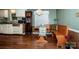 Cozy dining nook featuring a wooden bench, table, and bright window view at 2144 Newhart Rd, Charlotte, NC 28214