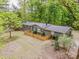Aerial view of this quaint home with a dark roof, matching paint, and a fence around the front yard at 2144 Newhart Rd, Charlotte, NC 28214