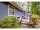 Exterior showcasing the side entrance and stairs up to the dark painted house at 2144 Newhart Rd, Charlotte, NC 28214