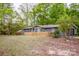 Exterior view of grey home with wooden fence at 2144 Newhart Rd, Charlotte, NC 28214