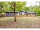 Charming single-story home featuring a well-manicured lawn and a classic picket fence enhancing curb appeal at 2144 Newhart Rd, Charlotte, NC 28214
