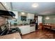 Well-lit kitchen area with modern appliances and a charming dining nook at 2144 Newhart Rd, Charlotte, NC 28214