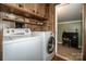 Laundry room featuring a modern, white washer and dryer combination at 2144 Newhart Rd, Charlotte, NC 28214