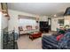 Comfortable living room featuring fireplace, a large TV, and ample seating at 2144 Newhart Rd, Charlotte, NC 28214