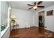 Cozy living room featuring wood-look floors and a ceiling fan with light fixture at 2144 Newhart Rd, Charlotte, NC 28214