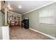 Cozy room with carpet, shelving unit, desk, and window to let the sun shine through at 2144 Newhart Rd, Charlotte, NC 28214