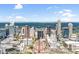 Stunning aerial view showcases Charlotte's skyline with modern architecture against a bright blue sky and verdant greenery at 222 S Caldwell St # 1510, Charlotte, NC 28202