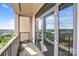 Outdoor balcony with glass doors overlooks a city at 222 S Caldwell St # 1510, Charlotte, NC 28202