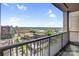Balcony view overlooking a green cityscape under a sunny sky at 222 S Caldwell St # 1510, Charlotte, NC 28202