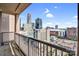 City views from this condo balcony showcase an urban panorama at 222 S Caldwell St # 1510, Charlotte, NC 28202