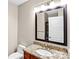 Bathroom with granite counters and view of laundry at 222 S Caldwell St # 1510, Charlotte, NC 28202