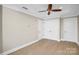 Bright bedroom features a ceiling fan, recessed lighting, and closet with double doors at 222 S Caldwell St # 1510, Charlotte, NC 28202