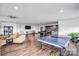 Large game room featuring a pool table, ping pong, and comfortable seating areas at 222 S Caldwell St # 1510, Charlotte, NC 28202