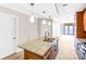 Bright kitchen boasts a granite-topped island with sink and pendant lighting, showcasing a welcoming design at 222 S Caldwell St # 1510, Charlotte, NC 28202