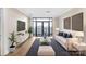 Bright living room featuring modern decor, a comfortable sofa, and a sliding glass door that provides city views at 222 S Caldwell St # 1510, Charlotte, NC 28202