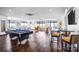 Spacious recreation room features hardwood floors, a pool table, and comfortable seating at 222 S Caldwell St # 1510, Charlotte, NC 28202