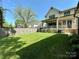 Expansive backyard with pristine lawn and inviting porch, perfect for outdoor gatherings at 2309 Pinckney Ave, Charlotte, NC 28205