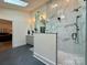 Modern bathroom featuring a glass enclosed shower, double vanity, and sleek fixtures at 2309 Pinckney Ave, Charlotte, NC 28205