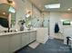 This bathroom features double vanity sinks, a glass enclosed shower, and modern fixtures at 2309 Pinckney Ave, Charlotte, NC 28205