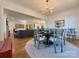 Open concept dining room with views into the kitchen and living room, hardwood floors, and elegant decor at 2309 Pinckney Ave, Charlotte, NC 28205