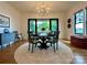Elegant dining room with modern chandelier, stylish decor, and large windows offering picturesque outdoor views at 2309 Pinckney Ave, Charlotte, NC 28205
