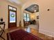 Inviting entryway leading to a home office, featuring hardwood floors and a custom ceiling at 2309 Pinckney Ave, Charlotte, NC 28205
