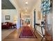 Bright and airy foyer featuring hardwood floors, elegant lighting, and a view into the living spaces at 2309 Pinckney Ave, Charlotte, NC 28205