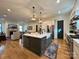 Open-concept kitchen and living area with hardwood floors and a large island at 2309 Pinckney Ave, Charlotte, NC 28205