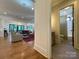 Spacious living room featuring an open floor plan leading to the bathroom with neutral tones and modern fixtures at 2309 Pinckney Ave, Charlotte, NC 28205